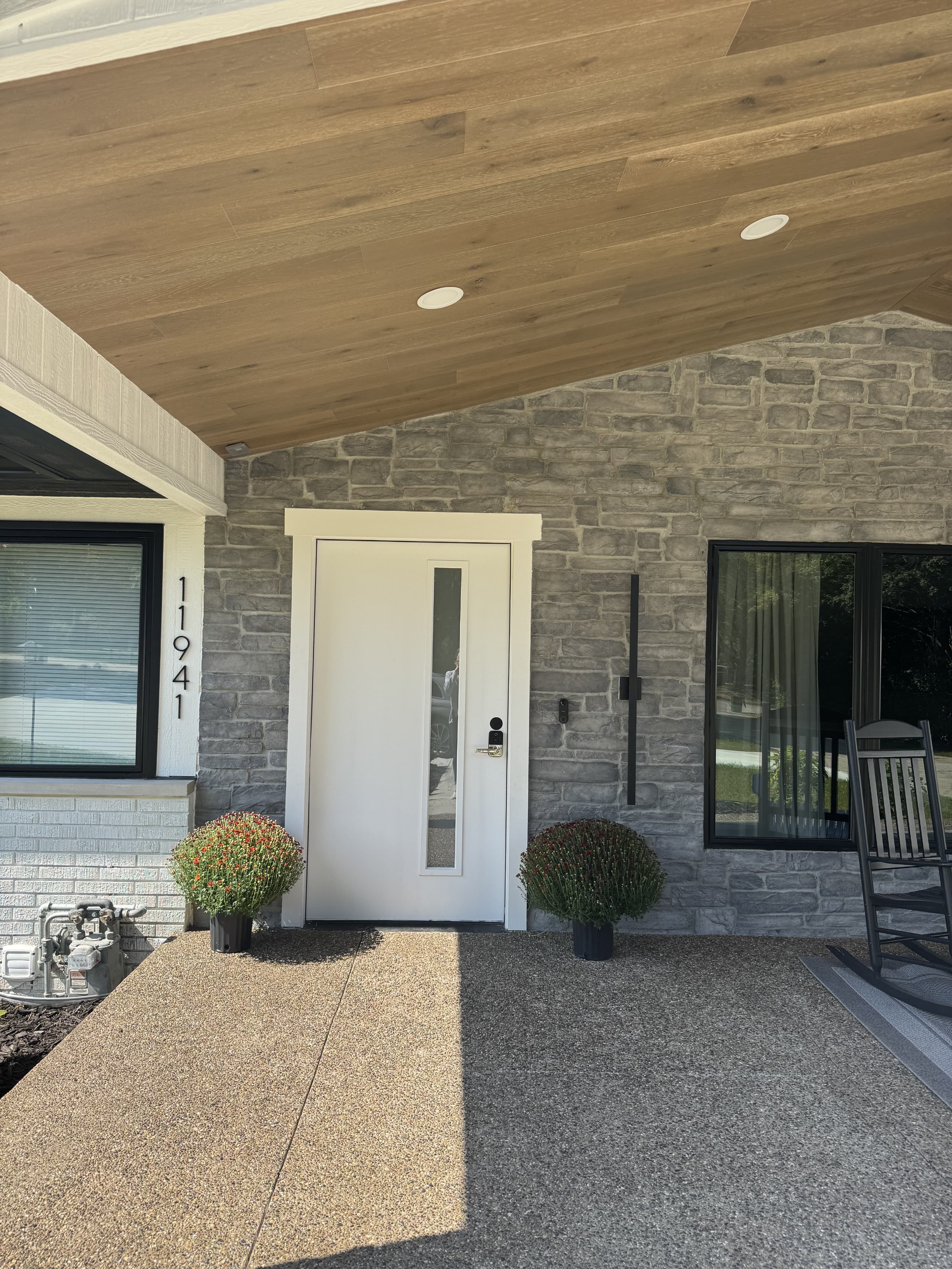 Welcoming front porch entrance with seating area