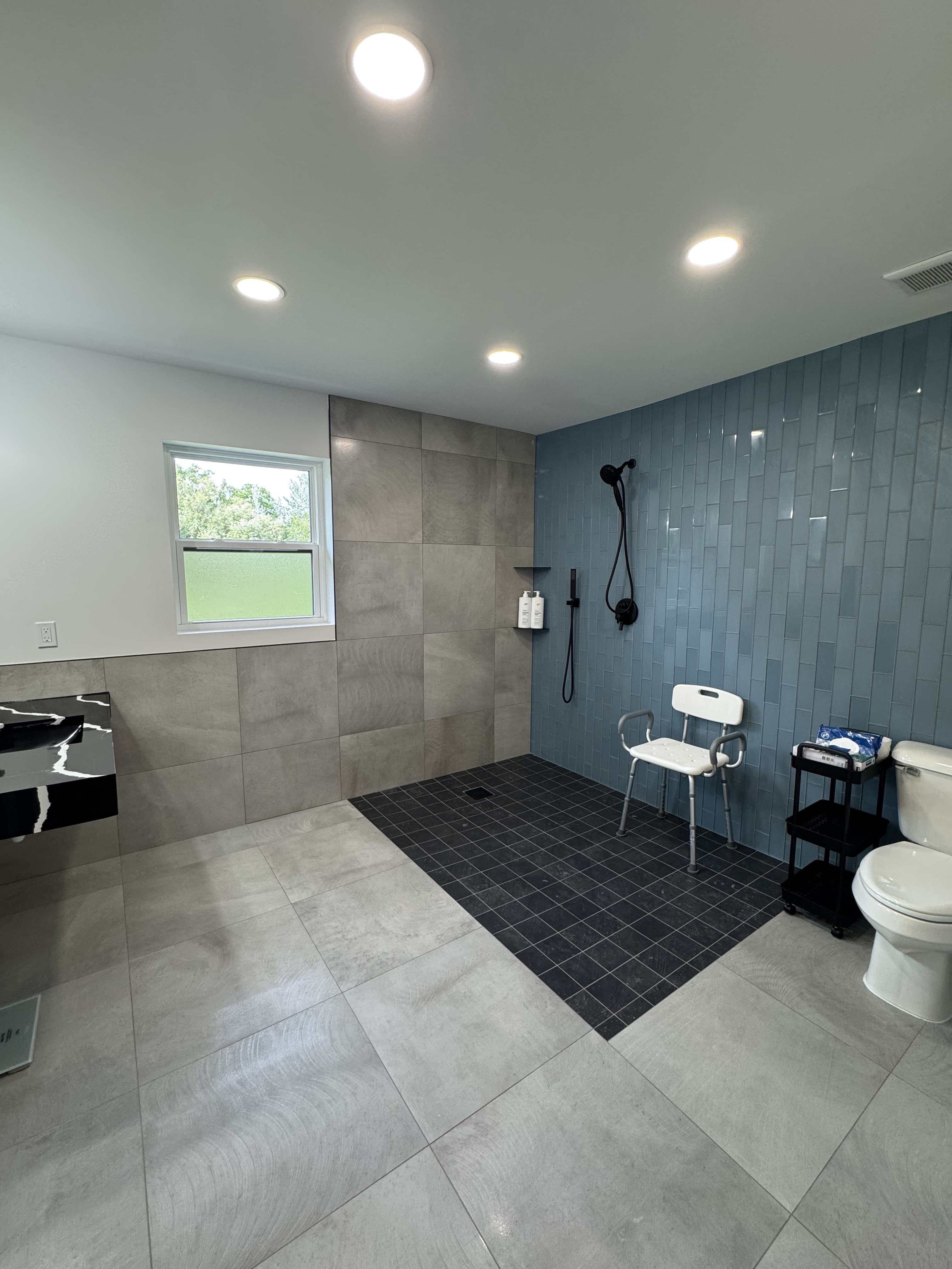 Main shared bathroom with shower facilities
